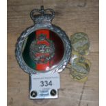 A Royal British Tank Regiment vehicle badge by J R Gaunt London and two similar badges.