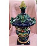 A 19th century Majolica lidded vase / urn, the urn shaped body decorated with flowers and acanthus