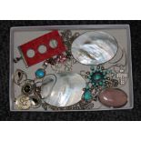 A tray of assorted silver and white metal jewellery.