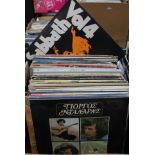 A box of approx. 65 rock and pop LPs.