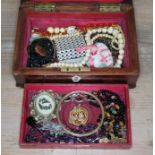 A Victorian jewellery box in form of a sarcophagus containing quantity of jewellery to include