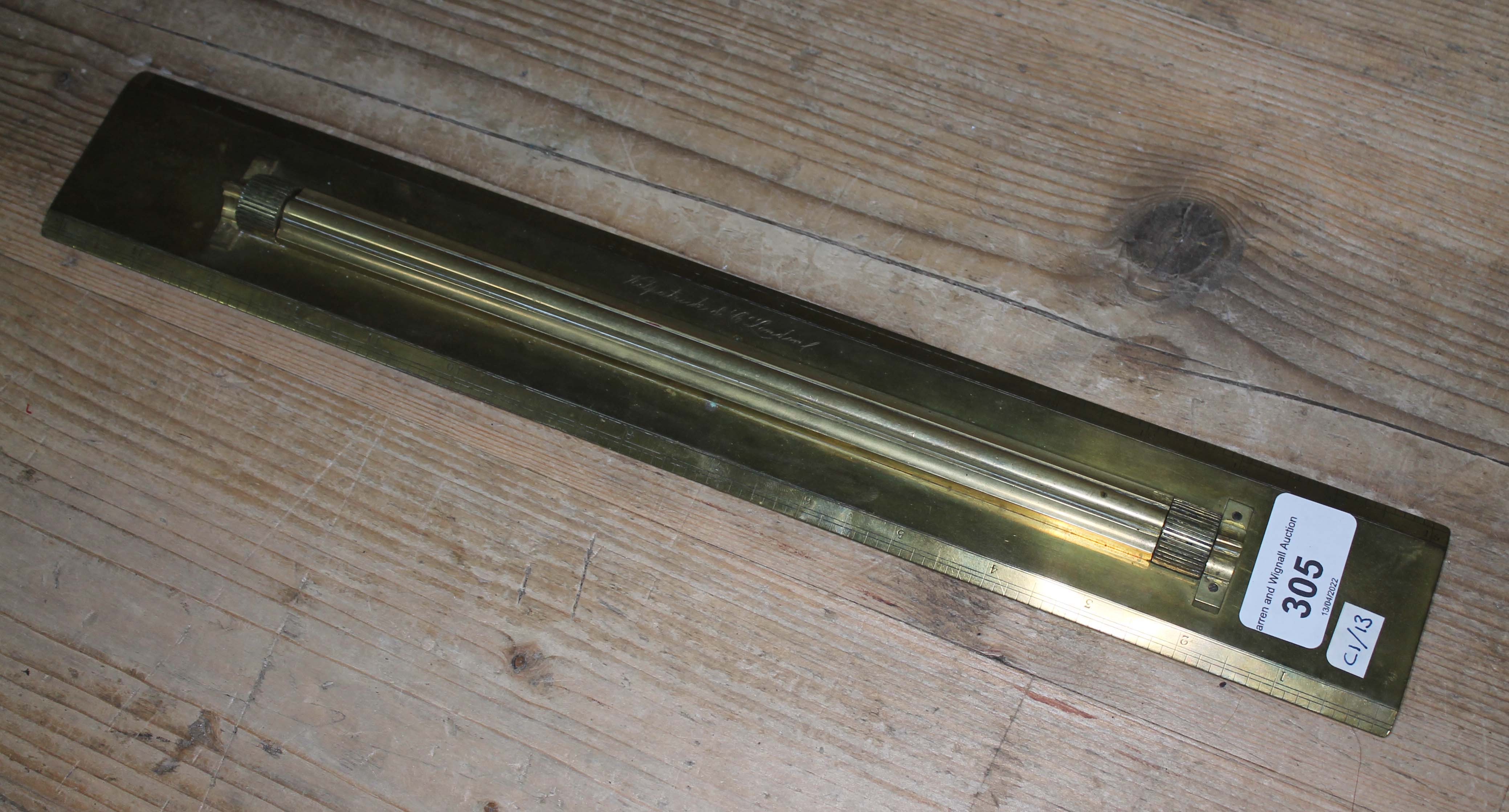 A brass navigational rolling ruler, by Kilpatrick & Co, London.