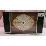 A mid 20th century Metamec "Atomic Eye" mantle clock