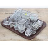 A tray of assorted mainly 19th century pressed glass salts including pair and novelty examples and