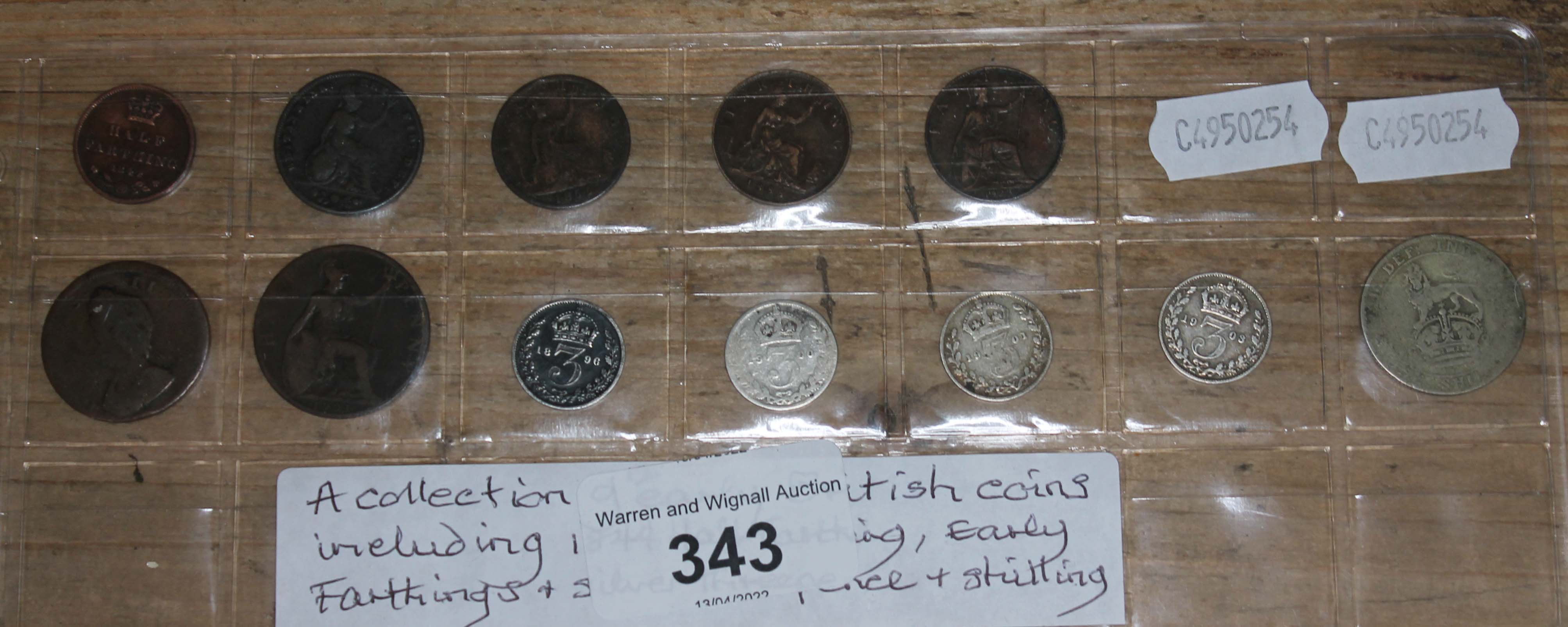 A collection of 12 early British coins including a half farthing 1884, three early farthings