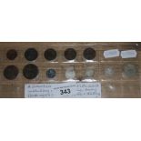 A collection of 12 early British coins including a half farthing 1884, three early farthings