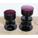 A pair of amethyst glass candlesticks designed by Ronald Stennett Wilson for Wedgwood, heights 9.5cm