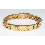A heavy curb link bracelet with identitiy tag 'KEN' set with a small diamond, 9ct gold import marks,