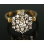 A diamond cluster ring, the hexagonal cluster measuring approx. 10.98mm x 13.09mm, hallmarked 18ct