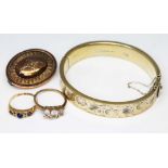 A mixed lot of jewellery comprising two hallmarked 9ct gold rings, one set with blue paste, gross