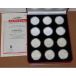 A cased set of twelve Gibraltar Warships of World War II silver proof commemorative coins, struck in