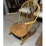An Ercol light beech and elm rocking chair.