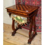 A 19th century inlaid rosewood games and work table with fitted interior and chess board top,