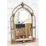 An early 19th century gilt metal framed mirror with twist arched wire frame with Classical masks,