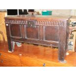 An 18th century five plank oak coffer with carved details to the front, height 62cm, width 103.5cm