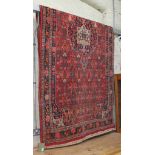 A Persian wool carpet, circa 1930s, approx. 280cm x 140cm.