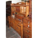 An Arts & Crafts light oak dresser with copper panel and strap hinges, width 153cm, depth 57cm &