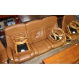 A German Himolla tan leather recliner sofa with two matching recliner armchairs and three