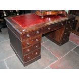 An oak pedestal desk, width 136cm, depth 73cm & height 70cm.