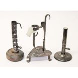 A group of three early metal candlesticks, heights 17cm to 24cm.