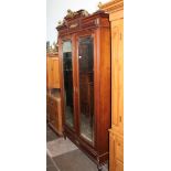 A continental gilt mounted walnut armoire with mirrored doors, width 126cm, depth 48cm & height