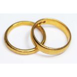 Two hallmarked 22ct gold wedding bands, wt. 10.54g, size Q.