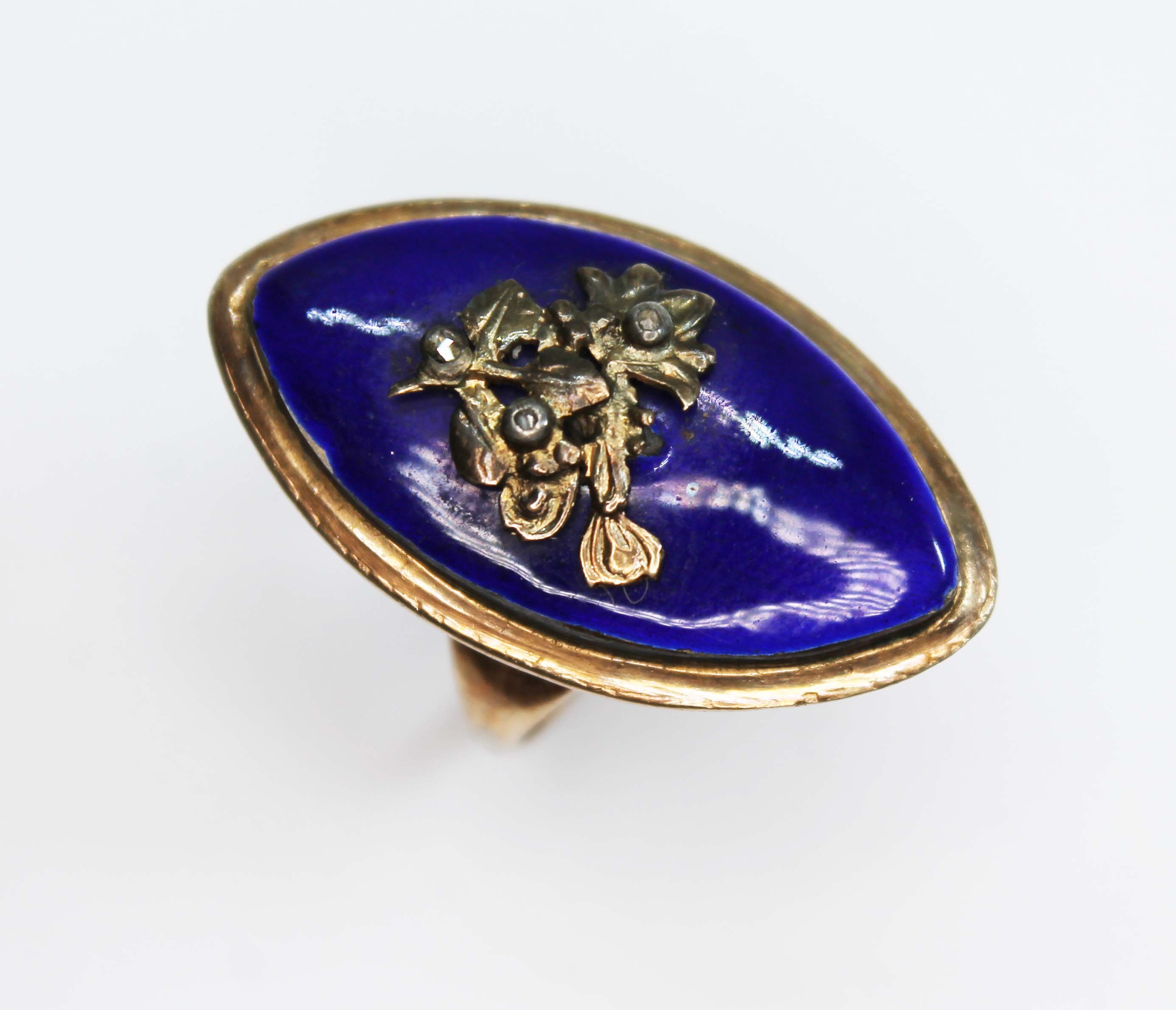 A late Georgian blue enamel and diamond navette shaped mourning ring, the blue enamel applied with a