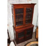 A late 19th century mahogany cabinet bookcase with carved panels and glazed doors, height 192.5cm,