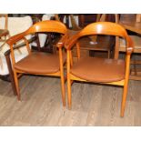 A pair of mid 20th century bentwood armchairs with vinyl upholstery, possibly Danish.