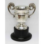 A hallmarked silver trophy, wt. 85.8g, with base.