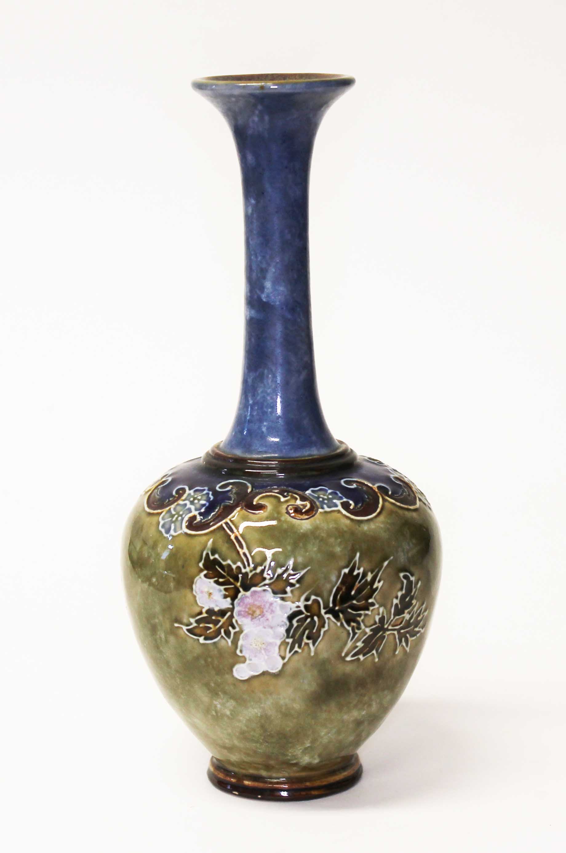 A Royal Doulton stoneware vase, height 26cm. Condition - good, general wear only.