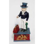 A reproduction cast metal money bank Uncle Sam.