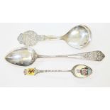 Three Continental silver spoons comprising a Norwegian souvenir spoon entitled 'Larvik' by Magnus