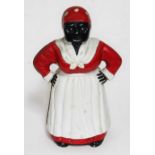 A cast metal money bank aunt Jemima.