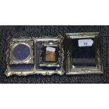 A group of four hallmarked silver photograph frames.