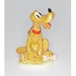 A Beswick Walt Disney Pluto figure. Condition - good, appears damage/repair free, general wear.