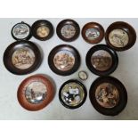 A collection of antique pot lids.
