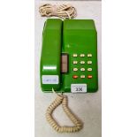 A retro green BT Viscount telephone.