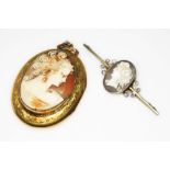 A gilt metal locket with shell cameo applied to front, length 55mm, together with a another cameo