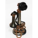 An early 20th century candlestick telephone.