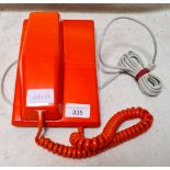 A retro orange BT Viscount telephone with dial under handle.