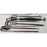 A collection of vintage shooting sticks and walking sticks.