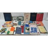 A box of mixed ephemera including Victorian prescriptions, postcard albums, vintage guide books etc.