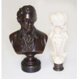A bronze seal modelled as a bust monogrammed 'SS' length 8.5cm, together with a carved ivory seal.