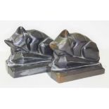 A pair of Art Deco style spelter bookends, each formed as a stylised sleeping fox, length 13cm.