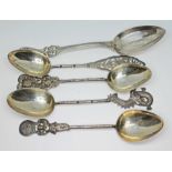 Four Chinese silver teaspoons and another spoon marked 'Sterling', wt. 83.6g.