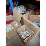 Four boxes of mixed items including football trading cards, tea and cigarette cards etc