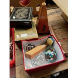 A mixed lot including 3 paperweights, harmonica, metronome, small tripod, leather jewellery box