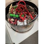 A hat box full of costume jewellery