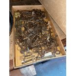 A box containing 150+ antique and vintage keys, mostly cabinet keys.